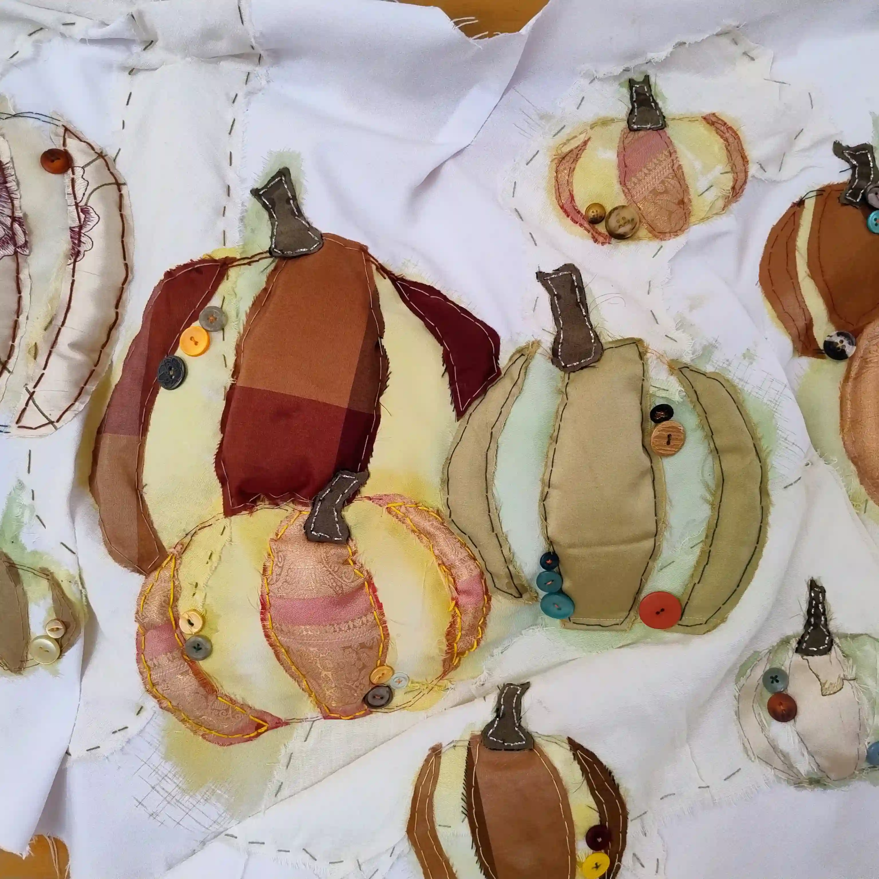 Pumpkins sewn into a piece of cloth